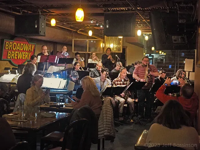 A soloist standing in front of the band